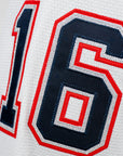 Embroidered number 16 on a sports jersey with red, blue, and white colors.
