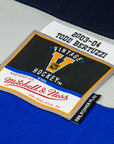 Close-up of a hockey jersey label with 'Vintage Hockey' and 'Mitchell & Ness' branding.