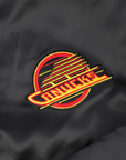 Vancouver Canucks Signature Collection Women's Reversible Sherpa Black Skate Bomber Jacket
