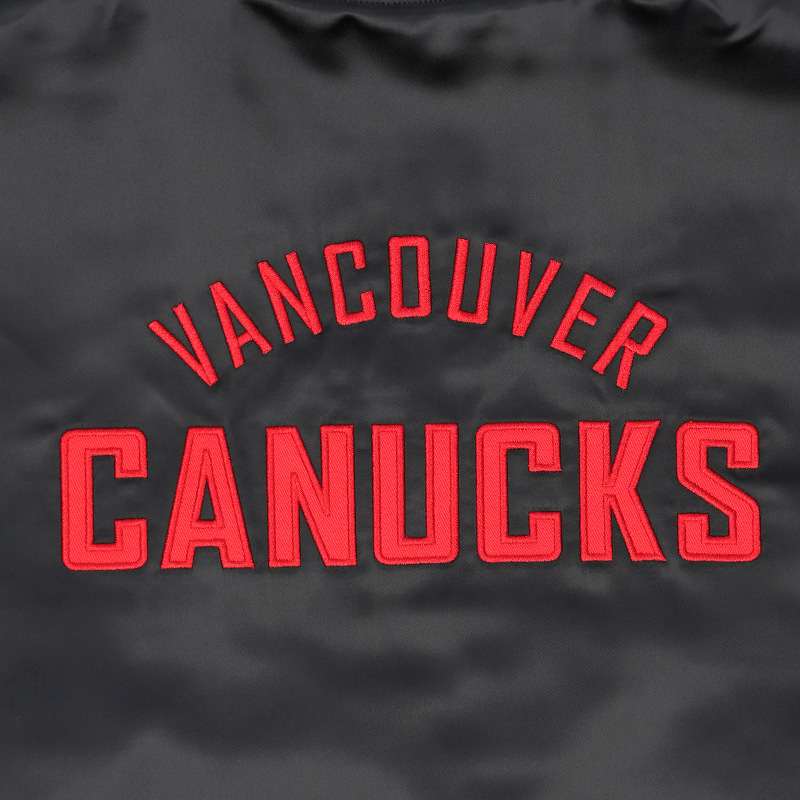 Vancouver Canucks Signature Collection Women's Reversible Sherpa Black Skate Bomber Jacket